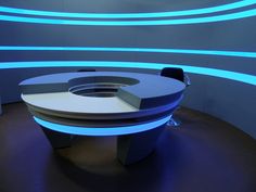 a round table with blue lights around it