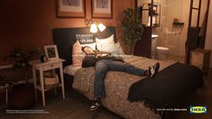 a man laying on top of a bed in a bedroom