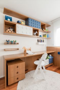 a child's room with white carpet and wooden shelves