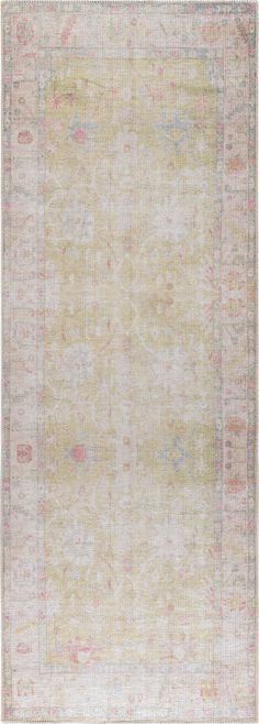 an antique rug with faded colors and fringes on the bottom, in beige tones