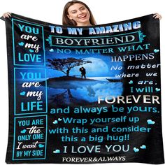 a woman holding up a blanket with the words i love you and an image of a man