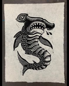 a black and white drawing of a fish with sharp teeth on it's back