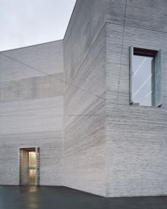 an empty building with a door and window