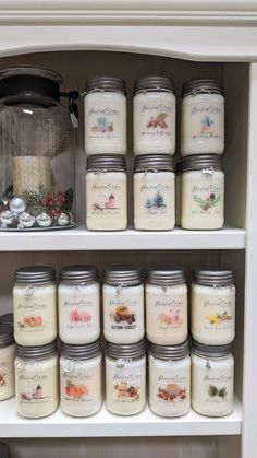 many jars are lined up on the shelf