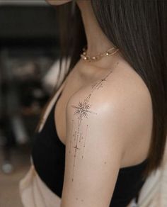 a woman with a star tattoo on her chest