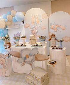 a baby's first birthday party with balloons and decorations