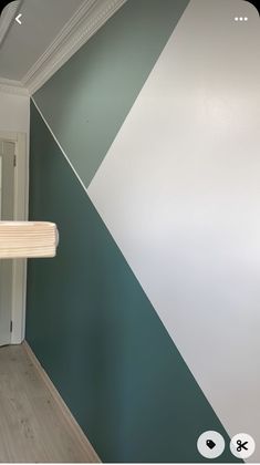 a room with green and white paint on the walls