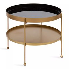 a round coffee table with two trays on each side and one shelf underneath it