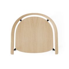 a wooden chair with black metal legs and an arch shaped like a headboard, on a white background