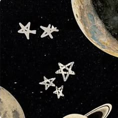 an image of space with stars and planets flying in the air above them, as if they were from outer space