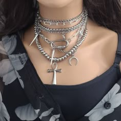 Make a bold statement with our heavy metal layered Punk rocker necklace set, crafted with only the finest stainless steel materials. This stunning set features 5 necklaces that can be worn separately or layered for a unique and edgy look. The set includes an ankh, moons, stars, and spikes that capture the essence of punk rocker style. Two of the necklaces double, or can be worn long instead of doubled, allowing for a variety of styling options. Not only is this statement piece necklace a great Y Emo Jewelry, Edgy Necklace, Goth Necklace, Edgy Accessories, Y2k Necklace, Pagan Jewelry, Goth Jewelry, Punk Rocker, Witchy Jewelry