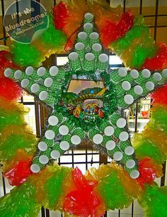 a christmas wreath made out of plastic cups