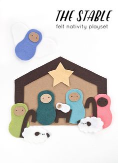 felt nativity play set with sheep and baby jesus in the manger, stars above it