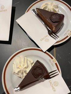 two pieces of chocolate pie on plates with forks