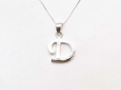 Letter D Pendant design made of Solid 925 Sterling Silver ☞ made to last.  Matching Ring & Earrings - please ask me   Details :  ♥ Each item comes in a cute GIFT BOX ✓ ♥ GUARANTEE on the materials ✓ ♥ Pure Solid 925 Sterling Silver ☞ Silver Hallmark on each piece ♕ ♥ More Beautiful jewellery on www.etsy.com/shop/AdinaStone ☜    ✉ ✉ Shipping by Royal Mail ✉ ✉ Tracked Shipping Option - worldwide tracking - choose at checkout: U.K. 1 Day delivery !  USA & Worldwide ✈ 5-7 Days  Standard Shipping spe Silver Letter Necklace, D Necklace, Initial D, Cute Gift Boxes, Letter D, Necklace Minimalist, Matching Rings, Initial Pendant, Letter Necklace