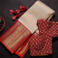 red and white silk saree with floral motifs on the border, along with other items