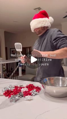 an old man in a santa hat making christmas cookies