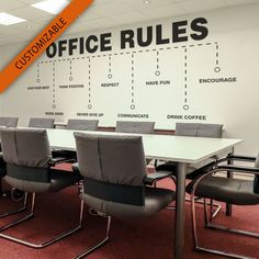 an office boardroom with chairs and a large wall sign that says office rules on it