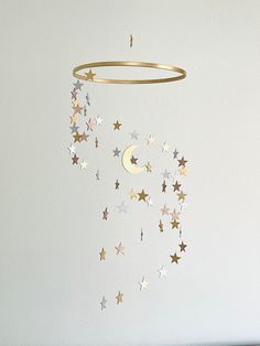 a mobile with stars and a crescent hanging from the ceiling