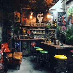 a bar with several stools and paintings on the wall