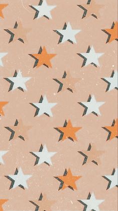 an orange and white star pattern on a pink background