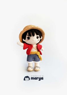 a small doll with a straw hat on it's head