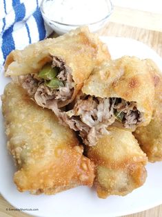 some food is on a white plate with a blue and white towel