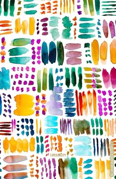 watercolor brushes and strokes are arranged on a white paper with blue, green, orange, and red colors