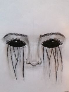 a drawing of a woman's face with tears