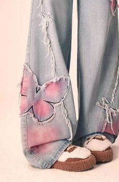 Rock these Distressed Pink Butterfly Jeans 🦋 and make a statement with their unique distressed design. These cute and pretty jeans feature edgy pink butterfly designs that will surely turn heads. Be bold and playful with your fashion choice! Size Chart: Size Waist (cm) Hip (cm) Length (cm) Waist (in) Hip (in) Length (in) S 63 94 100 24.80 37.01 39.37 M 67 98 101 26.38 38.58 39.76 L 71 102 102 27.95 40.16 40.16 XL 75 106 103 29.53 41.73 40.55 Description: Item Type: JeansJeans Style: High Waist Wide Leg PantsClosure Type: Zipper FlyMaterial: Cotton/LinenElasticity: Slight StretchLength: Full LengthFit Type: LooseDecoration: EmbroideryOrigin: CN Thickness: Regular Butterfly Core Outfits, Pants Design Ideas, Jeans With Patterns, Artsy Jeans, Jeans With Hearts, Pink And Blue Outfit, Butterfly Clothing, Wide Leg Jeans Women, Funky Jeans