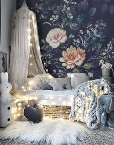 a bedroom decorated with lights and stuffed animals