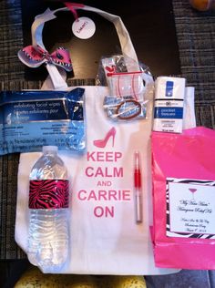 a white bag with pink and black items on it sitting on top of a table