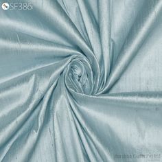 Powder Blue Pure Dupioni Fabric Shantung Raw Silk by the Yard 44" Wide Indian Wedding Dresses Curtains Cushions Costumes Pillow Cover Drapery Blouses ➤Color: Powder Blue  ➤Quality: The fabric is 100% dupioni silk of the highest grade. (100gsm) ➤Width: 44 inches ➤Code: sf386 ➤Listing for 1 Yard of fabric. Powder Blue dupioni silk or raw silk fabric, made from pure silk yarn. This is a very beautiful tone-on-tone Powder Blue Color. Indian dupioni silk or raw silk fabric, made from pure silk yarn. 100% pure silk fabric has been made in India by skilled loom weavers. This dupioni is perfect for bridal & bridesmaids dresses, drapery, quilting, pillows, & chair upholstery, Dresses, Tops, Blouses, Jackets, Crafting, Clutches or Evening Bags, embellish your clothes, Home Décor, Outdoor, Quilting, Dupioni Silk Dress, Drapery Curtains, Powder Blue Color, Raw Silk Fabric, Dupioni Silk, Bridal Bridesmaid Dresses, Silk Yarn, Color Powder, Indian Wedding Dress