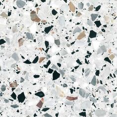 a white and black speckled surface with small rocks