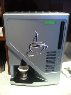 a coffee machine sitting on top of a counter