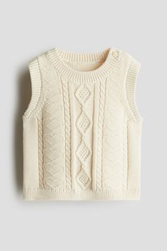 Sweater vest in cable-knit cotton. Round neck with a button on one side and ribbing at neck  armholes  and hem. Sportswear Trends, Sweater Vest Women, Cardigan Sweater Jacket, Chic Sweaters, Kids Outerwear, Kids Sweater, Fun Designs, Girls Sweaters