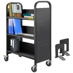 a black book cart with wheels and two books on the top shelf next to it