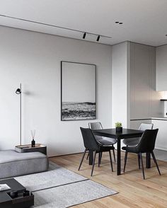 a living room and dining area with white walls