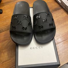 Women’s Gucci Rubber Slide Sandal Perforated Monogram Light Scuffs On Left Foot Dusts Bags Have Markings Black Rubber Gg Women's Molded Rubber Footbed Gucci Trademark Flat .6" Height Made In Italy 100% Authentic Product Is Embedded With An Rfid Tag Size 38 Fits 7 To 71/2 Gucci Luxury Round Toe Slides, Gucci Black Flat Slides, Black Gucci Slides With Rubber Sole, Gucci Black Slides With Cushioned Footbed, Gucci Black Slip-on Sandals, Rfid Tag, Gucci Black, Gucci Shoes, Black Rubber