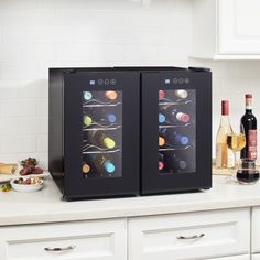 two wine coolers sitting on top of a kitchen counter