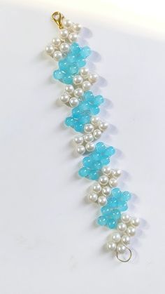 a blue and white beaded bracelet with pearls