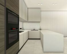 a modern kitchen with white cabinets and counter tops, along with an oven in the center