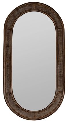 a mirror that is brown and has an oval frame on the front, it's dark