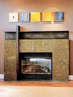 a living room with a fire place and pictures on the wall