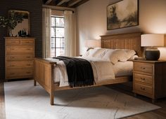 a bedroom scene with focus on the bed and dressers