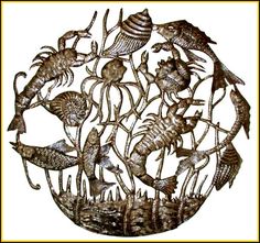 a metal artwork with sea animals and fish on it