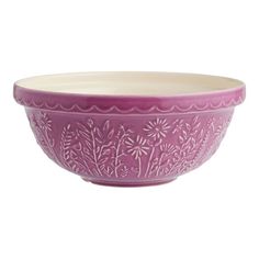 a purple bowl sitting on top of a white table