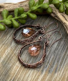 Sparkling Champagne Crystal Dangle Earrings, Copper Wire Wrapped, Artisan Jewelry, Hoops, Free Domestic Shipping, Great Gift 🌿These future heirloom earrings will adorn your earlobes with gorgeous Sparkly Champagne Colored Chinese Crystals, dangling from copper hand woven hoops Hand forged copper ear wires Free one day Shipping Satisfaction guaranteed or your money back. Heirloom Earrings, Jewelry Hoops, Sparkly Champagne, Copper Earrings Handmade, Wired Jewelry, Sparkling Champagne, String Art Patterns, Wrap Earrings, Art Patterns