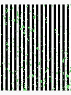 green and white paint splattered on black and white striped background with vertical stripes