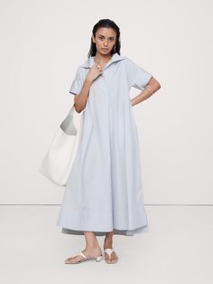 We reimagined the timeless kaftan silhouette with wide sleeves and slits at the side hem to show a little leg.  Here, we've cut this dress in our signature cotton poplin.  Relaxed fit with dropped shoulder.  Long, wide sleeves.  Deep v-neck with collar.  On-seam pockets.  Straight hem with high, side slits.  Unlined.  *This dress runs oversized.  Consider sizing down.  Relaxed fit.  Short sleeves.  Maxi length.  Model: Size S, 5'10" (178cm).  *This dress runs oversized.  Consider sizing down. New Frock, Royal Blue Maxi Dress, Flounce Hem Dress, Maxi Slip Dress, Maxi Shirt Dress, Blue Maxi, Striped Maxi Dresses, Banana Republic Dress, Midi Maxi Dress